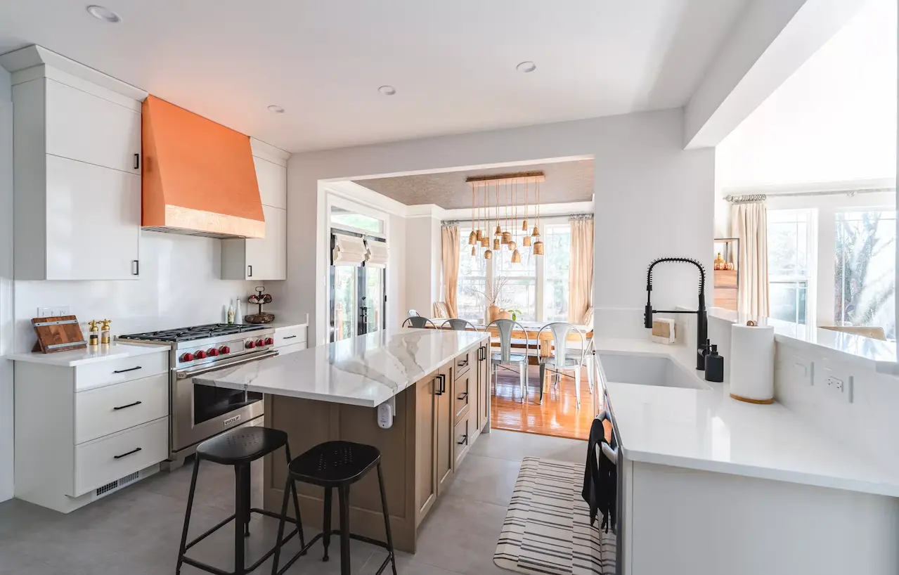 Modern kitchen designed by a best kitchen remodeling contractor in Virginia with custom cabinets and marble countertops